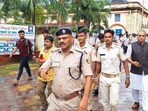 Police personnel investigate after a female student allegedly set herself on fire over sexual harassment at Fakir Mohan (Autonomous) College, in Balasore district, Odisha, Saturday, July 12, 2025.