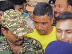 Security personnel and others escort Chaitanya Baghel (in yellow), the son of former Chhattisgarh CM Bhupesh Baghel, after his arrest by the Enforcement Directorate on July 18. (PTI) Security personnel and others escort Chaitanya Baghel (in yellow), the son of former Chhattisgarh CM Bhupesh Baghel, after his arrest by the Enforcement Directorate on July 18. (PTI)