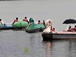 Visitors enjoying the rainy weather at Sukhna Lake in Chandigarh on Sunday. (Keshav Singh/HT) Visitors enjoying the rainy weather at Sukhna Lake in Chandigarh on Sunday. (Keshav Singh/HT)