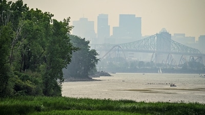 A smoky haze from wildfires, with a poor air quality rating, covers the skyline of Montreal, Quebec, Canada (REUTERS)