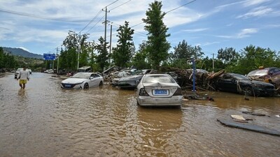 Beijing had six of its 16 districts on the highest alert for heavy rainfall. (AFP)