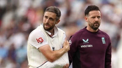 Chris Woakes leaves the field with his arm in a sling after sustaining an injury from a nasty fall. (AFP) Chris Woakes leaves the field with his arm in a sling after sustaining an injury from a nasty fall. (AFP)