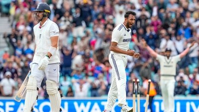 Prasidh Krishna backed up Siraj from the other end by reducing England to 350 for nine, a full ball trapping Josh Tongue in front and drawing a deafening roar from the partisan crowd. (PTI) Prasidh Krishna backed up Siraj from the other end by reducing England to 350 for nine, a full ball trapping Josh Tongue in front and drawing a deafening roar from the partisan crowd. (PTI)