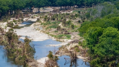 CENTER POINT, TEXAS - JULY 23: In an aerial view, the Guadalupe River is seen on July 23, 2025 in Center Point, Texas (Getty Images via AFP) CENTER POINT, TEXAS - JULY 23: In an aerial view, the Guadalupe River is seen on July 23, 2025 in Center Point, Texas (Getty Images via AFP)