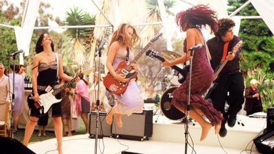 Lindsay Lohan as Anna Coleman performing with the fictional band "Pink Slip" in the final scene of the original 2003 film. (X/@yyungtaco) Lindsay Lohan as Anna Coleman performing with the fictional band "Pink Slip" in the final scene of the original 2003 film. (X/@yyungtaco)