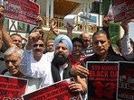 Congress supporters demanding the restoration of statehood in Jammu and Kashmir during a protest in Srinagar on Tuesday. (AFP Photo) Congress supporters demanding the restoration of statehood in Jammu and Kashmir during a protest in Srinagar on Tuesday. (AFP Photo)