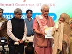 Jammu and Kashmir lieutenant governor Manoj Sinha handing over a job appointment letter to a family member of a terror victim in Srinagar on Tuesday. (Waseem Andrabi/HT) Jammu and Kashmir lieutenant governor Manoj Sinha handing over a job appointment letter to a family member of a terror victim in Srinagar on Tuesday. (Waseem Andrabi/HT)
