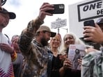 Trixie Garcia, second from right, poses for selfies with a Grateful Dead fans, following the unveiling of Jerry Garcia Street in San Francisco, on Aug. 1, Trixie Garcia, second from right, poses for selfies with a Grateful Dead fans, following the unveiling of Jerry Garcia Street in San Francisco, on Aug. 1,