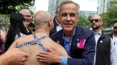 Mark Carney marched for approximately three-quarters of a mile along the route of the parade, which started outside of BC Place Stadium. Mark Carney marched for approximately three-quarters of a mile along the route of the parade, which started outside of BC Place Stadium.