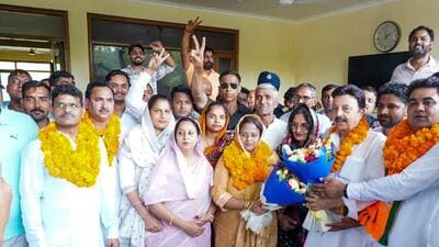 Parveen Yadav, Senior Deputy Mayor of Manesar Municipal Corporation and Reema Chauhan, Deputy Mayor with Rao Narbir Singh, Cabinet Minister in Manesar, in Gurugram, on Tuesday. (HT Photo)