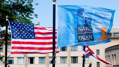 The U.S. and a NATO flags flutter ahead of a NATO summit in The Hague in June. The U.S. and a NATO flags flutter ahead of a NATO summit in The Hague in June.