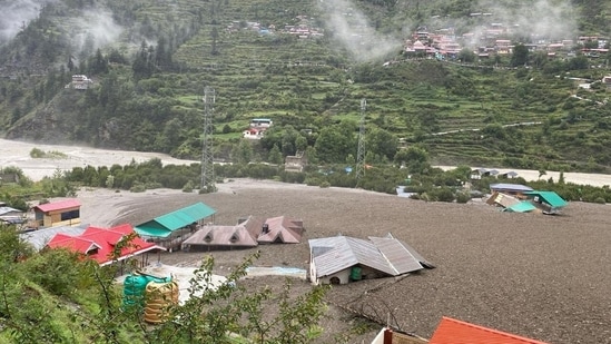 The cloudburst in Uttarakhand's Uttarkashi district led to flash floods in the Dharali village, along with mudslide which led to several houses being buried under debris.(via REUTERS)