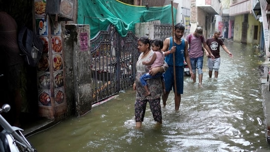 The Ganga was flowing above the danger level in Prayagraj, Mirzapur, Varanasi, Ghazipur and Ballia districts of Uttar Pradesh.(Rajesh Kumar Singh/AP Photo)