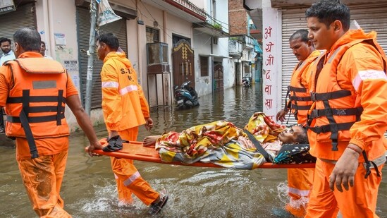 SDRF personnel were seen rescuing elderly people from flood-affected areas in Uttar Pradesh.(PTI)