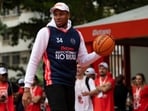 Giannis Antetokounmpo, of Greece, who plays with the Milwaukee Bucks, attends the inauguration of a renovated basketball court in Rio de Janeiro, Monday, June 9, 2025. (AP Photo/Bruna Prado)