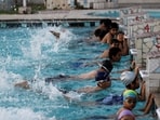 Making a splash: Children learning to swim at a pool in Faridabad. (Nadeem Hassan / Hindustan Times)