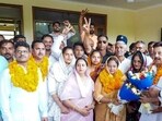 Parveen Yadav, Senior Deputy Mayor of Manesar Municipal Corporation and Reema Chauhan, Deputy Mayor with Rao Narbir Singh, Cabinet Minister in Manesar, in Gurugram, on Tuesday. (HT Photo)