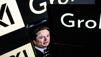 Screens displaying the logo of Grok, a generative artificial intelligence chatbot developed by xAI, the American company specializing in artificial intelligence and it's founder South African businessman Elon Musk. (AFP) Screens displaying the logo of Grok, a generative artificial intelligence chatbot developed by xAI, the American company specializing in artificial intelligence and it's founder South African businessman Elon Musk. (AFP)