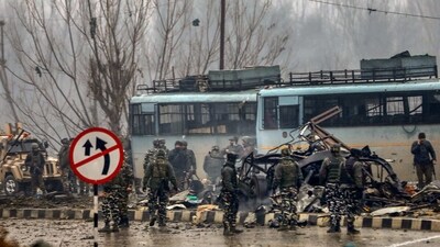 In this file picture from February 14, 2019, security personnel are seen carrying out the rescue and relief works at the site of suicide bomb attack at Lathepora, Awantipora in Pulwama district of south Kashmir. (PTI FILE) In this file picture from February 14, 2019, security personnel are seen carrying out the rescue and relief works at the site of suicide bomb attack at Lathepora, Awantipora in Pulwama district of south Kashmir. (PTI FILE)