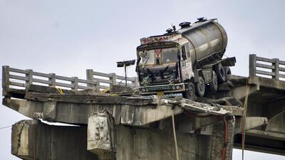 Rescue operation to retrieve a truck underway at the site of the Gambhira bridge collapse in Anand on Aug. 5 (PTI) Rescue operation to retrieve a truck underway at the site of the Gambhira bridge collapse in Anand on Aug. 5 (PTI)