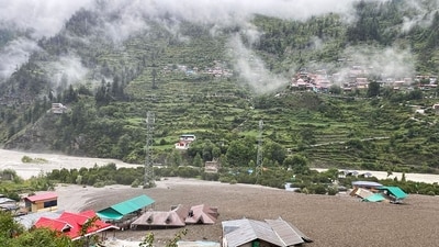 Residential buildings partially submerged in sludge after a cloudburst caused a massive mudslide in India's Uttarakhand state. (AFP)