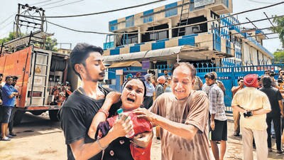 The kin of victims in an inconsolable state at the mishap site, in Industrial Area, Phase 9, Mohali, on Wednesday. (SANJEEV SHARMA/HT) The kin of victims in an inconsolable state at the mishap site, in Industrial Area, Phase 9, Mohali, on Wednesday. (SANJEEV SHARMA/HT)