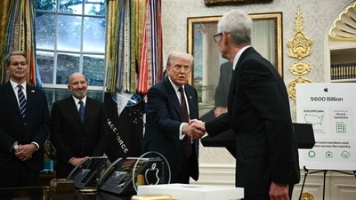 Apple CEO Tim Cook shakes hands with US President Donald Trump at the Oval Office (AFP) Apple CEO Tim Cook shakes hands with US President Donald Trump at the Oval Office (AFP)