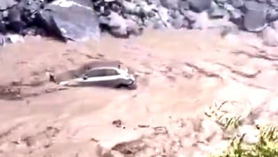 A chilling video shows a car being swept away by floodwaters in Uttarakhand A chilling video shows a car being swept away by floodwaters in Uttarakhand