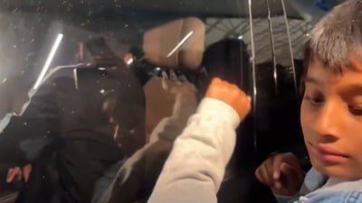 A kid knocks at the window of Mohammed Siraj's car A kid knocks at the window of Mohammed Siraj's car