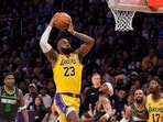 Los Angeles Lakers forward LeBron James (23) shoots as Minnesota Timberwolves guard Nickeil Alexander-Walker (9) defends during the first half in Game 5 of an NBA basketball first-round playoff series Wednesday, April 30, 2025, in Los Angeles. (AP Photo/Mark J. Terrill, File)