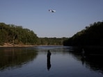 A man fly fishes in the Mississippi River in Minneapolis, Minnesota, U.S. May 11, 2025. REUTERS/Suzanne Plunkett