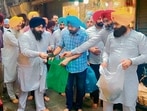 Punjab education minister Harjot Singh Bains performs sewa in Amritsar on Wednesday.