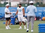 Los Angeles Chargers offensive tackle Rashawn Slater (70) talks to a coach on the field during an NFL training camp Monday Los Angeles Chargers offensive tackle Rashawn Slater (70) talks to a coach on the field during an NFL training camp Monday