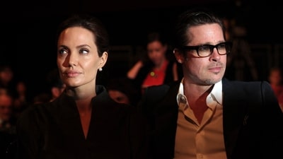 Brad Pitt and Angelina Jolie signed off on a divorce settlement on December 30, 2024. (Photo by CARL COURT / AFP) Brad Pitt and Angelina Jolie signed off on a divorce settlement on December 30, 2024. (Photo by CARL COURT / AFP)