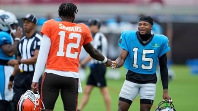 Cleveland Browns quarterback Shedeur Sanders greets Carolina Panthers wide receiver Jimmy Horn Jr. (AP) Cleveland Browns quarterback Shedeur Sanders greets Carolina Panthers wide receiver Jimmy Horn Jr. (AP)