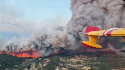 This aerial photograph taken on board a French Civil Security Canadair aircraft shows the fire raging in the department of Aude, in the south of France. The largest wildfire, which started on August 5, of the summer in France ravaged 16,000 hectares of vegetation and pine forest by August 6, 2025, evening, (AFP) This aerial photograph taken on board a French Civil Security Canadair aircraft shows the fire raging in the department of Aude, in the south of France. The largest wildfire, which started on August 5, of the summer in France ravaged 16,000 hectares of vegetation and pine forest by August 6, 2025, evening, (AFP)