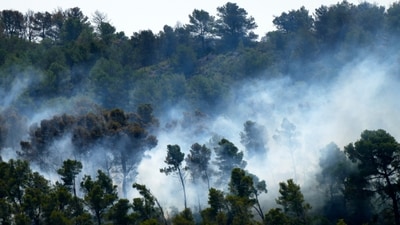 Smoke billows from France's largest wildfire in decades near Saint-Laurent-de-la-Cabrerisse, southern France, Thursday, August.7, 2025. (AP) Smoke billows from France's largest wildfire in decades near Saint-Laurent-de-la-Cabrerisse, southern France, Thursday, August.7, 2025. (AP)