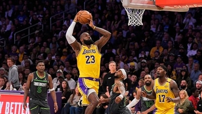 Los Angeles Lakers forward LeBron James (23) shoots as Minnesota Timberwolves guard Nickeil Alexander-Walker (9) defends during the first half in Game 5 of an NBA basketball first-round playoff series Wednesday, April 30, 2025, in Los Angeles. (AP Photo/Mark J. Terrill, File) Los Angeles Lakers forward LeBron James (23) shoots as Minnesota Timberwolves guard Nickeil Alexander-Walker (9) defends during the first half in Game 5 of an NBA basketball first-round playoff series Wednesday, April 30, 2025, in Los Angeles. (AP Photo/Mark J. Terrill, File)