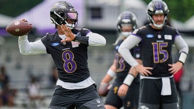 Baltimore Ravens quarterback Lamar Jackson (8) throws as quarterbacks Devin Leary (13) and Cooper Rush (15) watch (AP) Baltimore Ravens quarterback Lamar Jackson (8) throws as quarterbacks Devin Leary (13) and Cooper Rush (15) watch (AP)