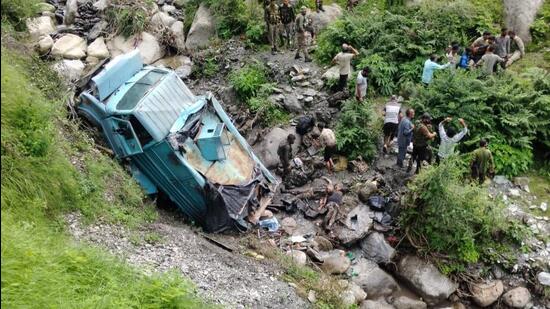 The Central Reserve Police Force (CRPF) vehicle that rolled down a gorge in Basantgarh area of Udhampur district on Thursday. (HT Photo)