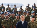 Canadian Prime Minister Mark Carney, stands alongside Gen. Jennie Carignan, Chief of the Defence Staff, during a major national defence announcement event at CFB Trenton in Trenton, Ontario, Canada, August 8, 2025. REUTERS/Cole Burston