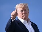 US President Donald Trump points as he boards Air Force One at RAF Lossiemouth, north-east Scotland. US President Donald Trump points as he boards Air Force One at RAF Lossiemouth, north-east Scotland.