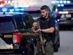 An armed Police officer prepares near the scene of shooting at the Emory University in Atlanta on Friday, Aug. 8, 2025. (AP Photo/Mike Stewart) An armed Police officer prepares near the scene of shooting at the Emory University in Atlanta on Friday, Aug. 8, 2025. (AP Photo/Mike Stewart)