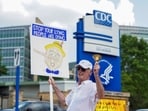 A man holds a sign as demonstrators gather outside of the U.S. Centers for Disease Control and Prevention (CDC) on June 25. (Representational)