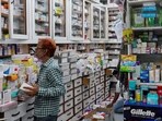 An employee sorts medicines in a medicine wholesale shop in Lucknow, India, Thursday, Aug. 7, 2025 (AP Photo/Rajesh Kumar Singh)