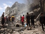 Palestinians check the devastation following an Israeli strike that hit Gaza City's southern al-Zeitoun neighbourhood on August 8, 2025.