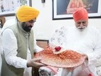 Punjab chief minister Bhagwant Mann with Dera Sachkhand Ballan head Sant Niranjan Dass on Thursday. (HT) Punjab chief minister Bhagwant Mann with Dera Sachkhand Ballan head Sant Niranjan Dass on Thursday. (HT)