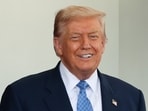 Donald Trump reacts next to Azerbaijan President Ilham Aliyev outside the White House in Washington, D.C.