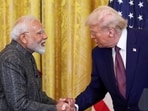 FILE PHOTO: President Donald Trump and Prime Minister Narendra Modi shake hands