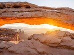 Sunrise at Mesa Arch in Canyonlands National Park in Utah, which receives much thinner crowds in August.